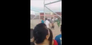 Angry security guard slams gate shut after crowd broke the lock at Halaevalu wharf