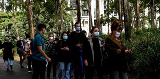 Young people warned after Covid-19 death of Sydney woman in her 30s