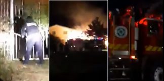 Firefighters breaking down gates in attempt to put out house fire at Tufumāhina royal residence