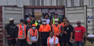 Volunteers put heart and soul into loading aid containers for Tonga