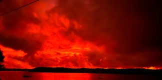 Residents share photos of apocalyptic red skies in wake of Hungas large volcanic activities