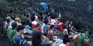 Island decimated by tsunami: Photos show emotional gathering of Mango survivors