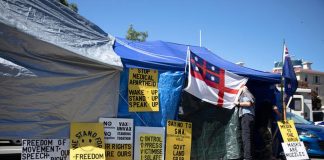Police and protesters face off near Parliament for 14th day
