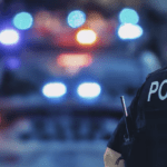 us-policeman-and-police-car-file-image-CYPJ7YPM6VGPBHXNFUSPY5HTDQ copy
