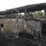 a-rescuer-inspects-a-bus-that-caught-fire-carrying-young-stu-HAPQONRRVJCSTDZJ6CKFDIZWVU copy