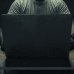 man-uses-computer-in-the-dark-file-image-YIO2GR5YHVEUHJU53TGWGWW6IA copy