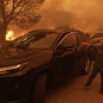 a-woman-cries-as-the-palisades-fire-advances-in-the-pacific-VIYOTVKPRJF2JKGNOCQZGSJQJQ copy