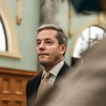 Minister steps down