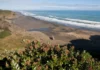Search underway for fisherman swept off rocks near Piha