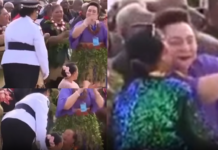 Police escort woman away after kissing Princess Pilolevu during new church celebration performance