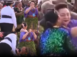 Police escort woman away after kissing Princess Pilolevu during new church celebration performance