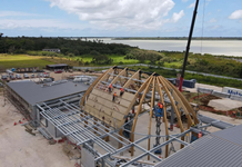 Tonga’s new Parliament rises above foundations as sweeping timber roof takes shape