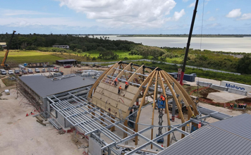 Tonga’s new Parliament rises above foundations as sweeping timber roof takes shape